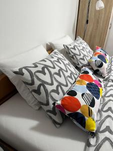 a bed with two pillows on top of it at Rooms Horvat in Krapina