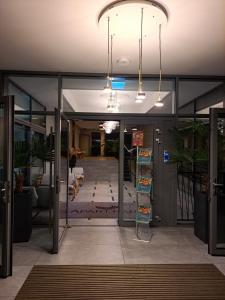 an open lobby with glass doors and a hallway at Apartament RUBUS 305 Sofii in Świnoujście +136 photos