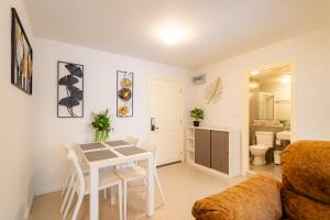 a living room with a table and a couch at Luxury 2 bedroom Condo Old city 168 in Chiang Mai +189 photos