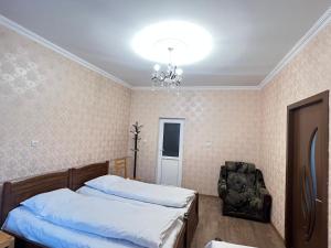 Katil atau katil-katil dalam bilik di Mikheil Pitskhelauri Guest House
