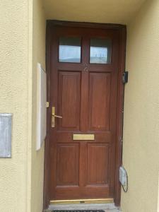 a wooden door in the side of a building at Two bedroom apartment in Ennis v95D854 in Ennis