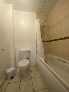 a bathroom with a toilet and a tub and a sink at Two bedroom apartment in Ennis v95D854 in Ennis