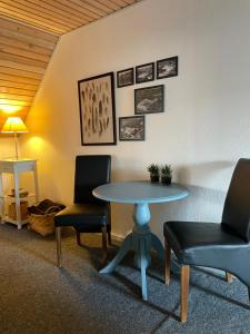 a room with a table and two chairs at Landligt ophold på Midtgård in Vamdrup +28 photos