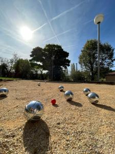 a group of silver helmets sitting on top of a field at Seuls en Pleine Nature - Gîte la Côte Blanche in Puygaillard-de-Quercy