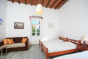 A bed or beds in a room at Paros Rita Studios