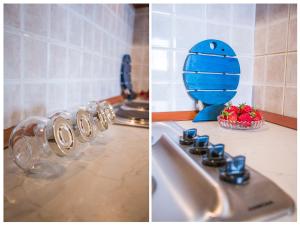 a kitchen counter with a sink and a bottle of water at Apartment Seagull in Split +31 photos