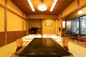 Una cama o camas en una habitación de Ryokan Hiyoshi