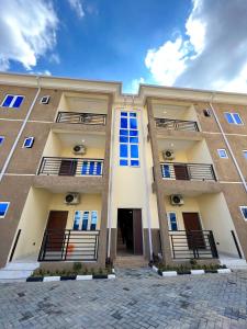 a building with balconies on the side of it at Sparkles Apartments in Abuja