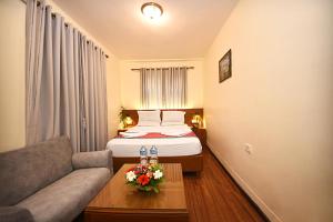 Rúm í herbergi á Hotel Amaryllis Kathmandu