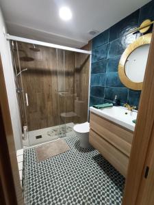 a bathroom with a shower and a sink and a toilet at LOS PEPINOS ( mi lugar favorito ) in Zamora