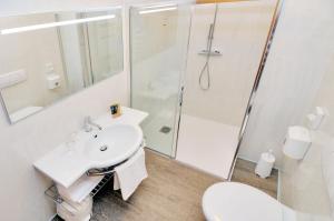a bathroom with a sink and a shower at Eco Hotel Cleofe in Caorle