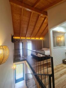 Postel nebo postele na pokoji v ubytování Ermo Loft - Casas do Ermo