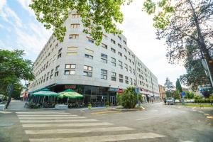 a large white building on a city street at Apartment Seagull in Split