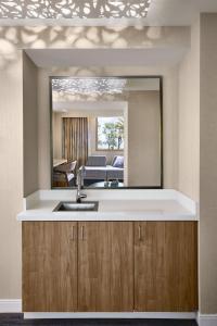 a kitchen with a sink and a mirror at The Westin San Francisco Airport in Millbrae