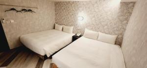 Letto o letti in una camera di 慶爾喜旅館Goodscompany