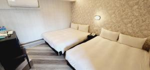 Letto o letti in una camera di 慶爾喜旅館Goodscompany
