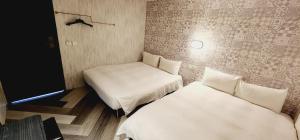 Letto o letti in una camera di 慶爾喜旅館Goodscompany