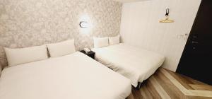 Letto o letti in una camera di 慶爾喜旅館Goodscompany
