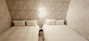 Letto o letti in una camera di 慶爾喜旅館Goodscompany