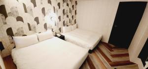 Letto o letti in una camera di 慶爾喜旅館Goodscompany
