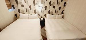 Letto o letti in una camera di 慶爾喜旅館Goodscompany