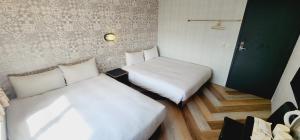 Letto o letti in una camera di 慶爾喜旅館Goodscompany