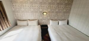 Letto o letti in una camera di 慶爾喜旅館Goodscompany