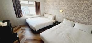 Letto o letti in una camera di 慶爾喜旅館Goodscompany