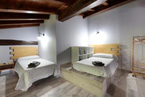 Postel nebo postele na pokoji v ubytování Ondarbaso Apartamentos Rurales III