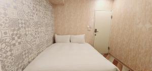 Voodi või voodid majutusasutuse 慶爾喜旅館長沙館Cheers Loft Self Check-in Hotel toas