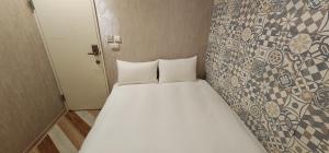Voodi või voodid majutusasutuse 慶爾喜旅館長沙館Cheers Loft Self Check-in Hotel toas