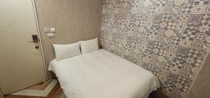 Voodi või voodid majutusasutuse 慶爾喜旅館長沙館Cheers Loft Self Check-in Hotel toas