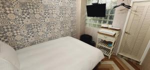 Voodi või voodid majutusasutuse 慶爾喜旅館長沙館Cheers Loft Self Check-in Hotel toas