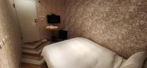 Voodi või voodid majutusasutuse 慶爾喜旅館長沙館Cheers Loft Self Check-in Hotel toas