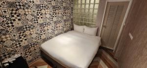 Voodi või voodid majutusasutuse 慶爾喜旅館長沙館Cheers Loft Self Check-in Hotel toas