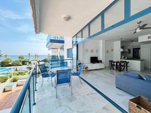 an open living room with a view of the ocean at PUSHE Castell de Ferro Beach & Tradition 2 in Castell de Ferro