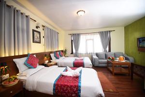 Rúm í herbergi á Hotel Amaryllis Kathmandu