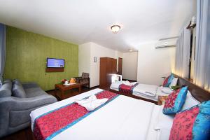 Rúm í herbergi á Hotel Amaryllis Kathmandu