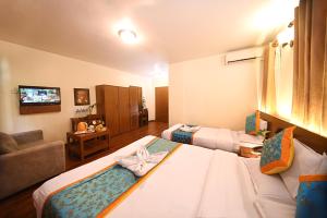 Rúm í herbergi á Hotel Amaryllis Kathmandu
