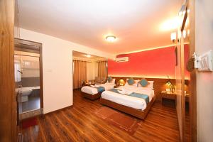 Rúm í herbergi á Hotel Amaryllis Kathmandu