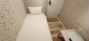 Voodi või voodid majutusasutuse 慶爾喜旅館長沙館Cheers Loft Self Check-in Hotel toas