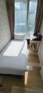 Voodi või voodid majutusasutuse 慶爾喜旅館長沙館Cheers Loft Self Check-in Hotel toas