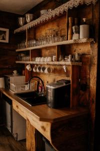 a kitchen with a sink and a counter top at Osmolicka Chatka in Ryki