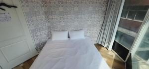 Voodi või voodid majutusasutuse 慶爾喜旅館長沙館Cheers Loft Self Check-in Hotel toas