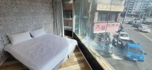 Voodi või voodid majutusasutuse 慶爾喜旅館長沙館Cheers Loft Self Check-in Hotel toas