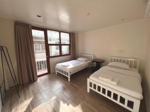 Katil atau katil-katil dalam bilik di Krung Tone Hostel