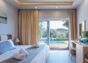 Posteľ alebo postele v izbe v ubytovaní Doroufi Inn + 37 fotografií