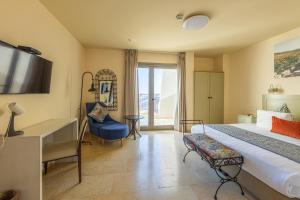 TV a/nebo společenská místnost v ubytování Yehelim Boutique Hotel