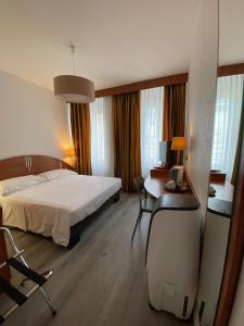 Postel nebo postele na pokoji v ubytování Hotel Admiral