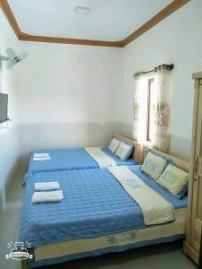 Postel nebo postele na pokoji v ubytování Khách Sạn Hoàng Hải Ninh Thuận